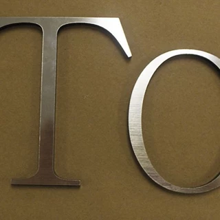 Acrylic Letters (Laser Cut) Overlaid with Brushed Chrome Romark