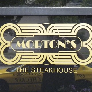 Lettering applied to windows of local, upscale steakhouse